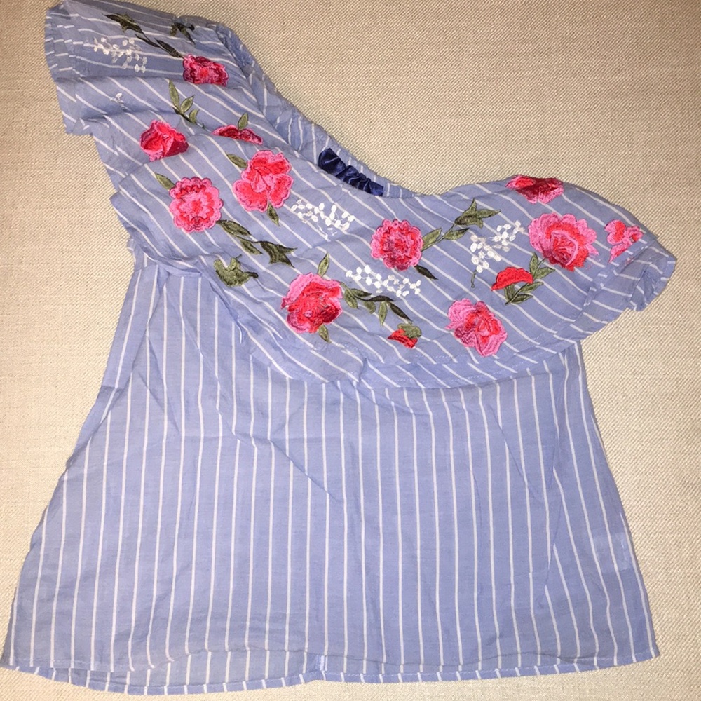One sleeve ruffle shirt.
